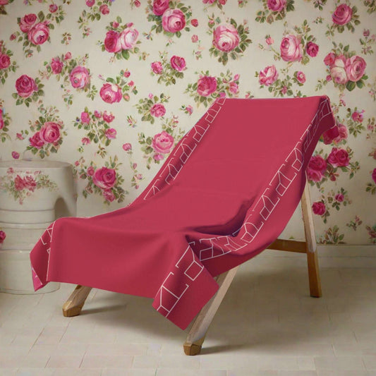 Bath Towel - Cerise 36" x 72" displayed in a chic Parisian powder room with delicate floral wallpaper in hues of pink to coordinate with the Cerise Bath Towel
