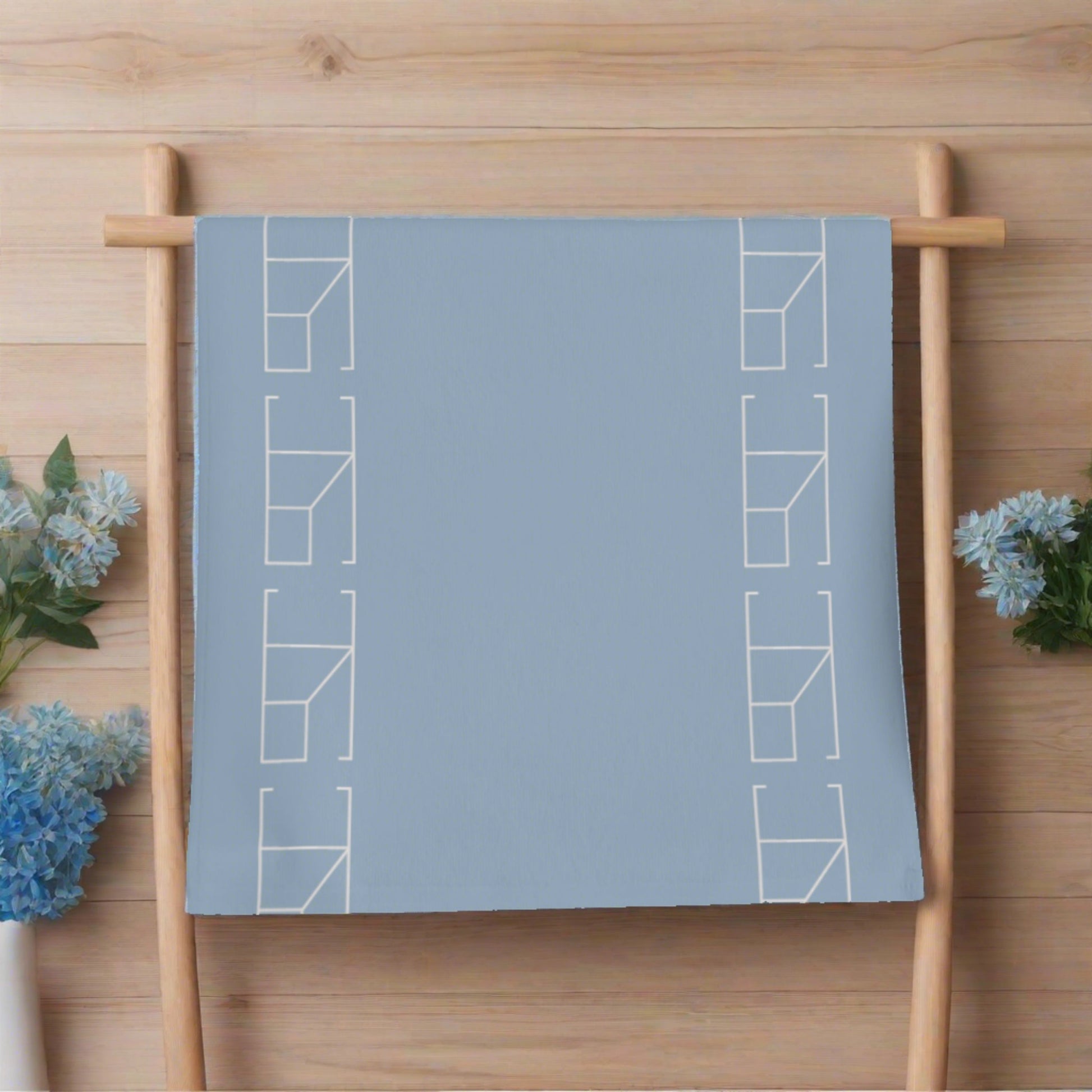 Blue Mist hand towel hanging from a wooden ladder
