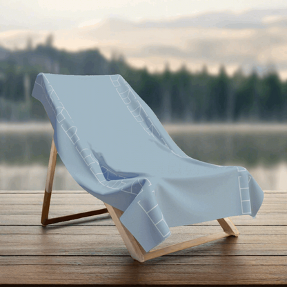 Bath Towel - Pearl Mist Gray on a wooden platform with a paerl lake and a blurred backround with a soft mist and a forest